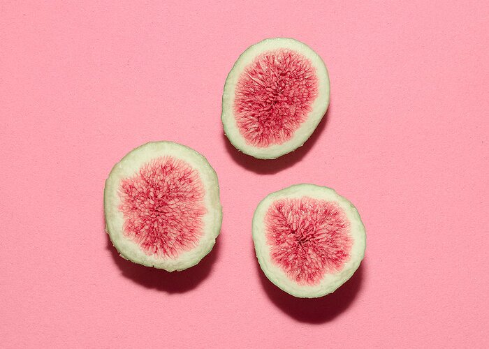 Figs Greeting Card featuring the photograph Fresh Figs On Pink Backgroundvanilla by Evgeniya Porechenskaya