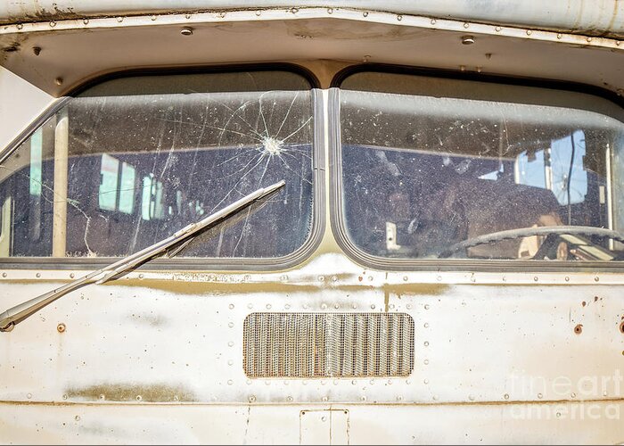 Junkyard Greeting Card featuring the photograph Front of an old Bus in a junkyard by Edward Fielding