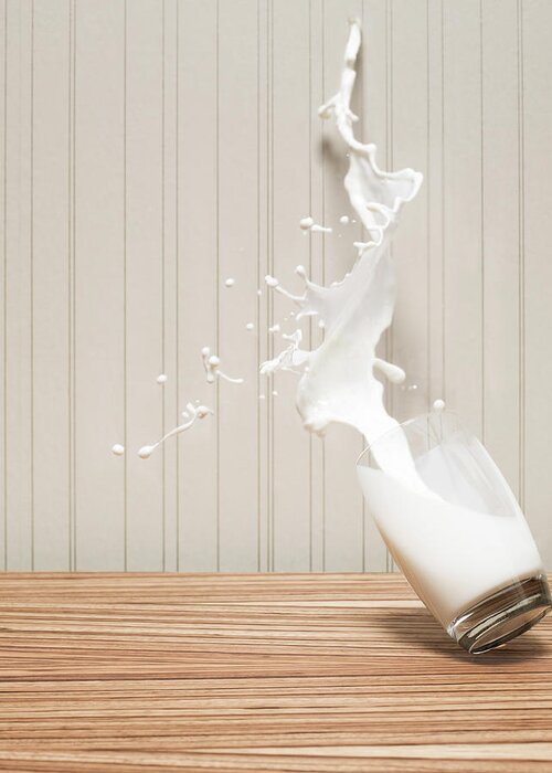 Milk Greeting Card featuring the photograph Glas Of Milk Spilling by Henrik Sorensen