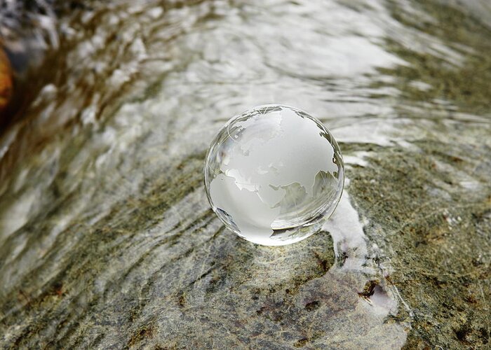 Environmental Conservation Greeting Card featuring the photograph Glass Globe On The Water Stream by Sot