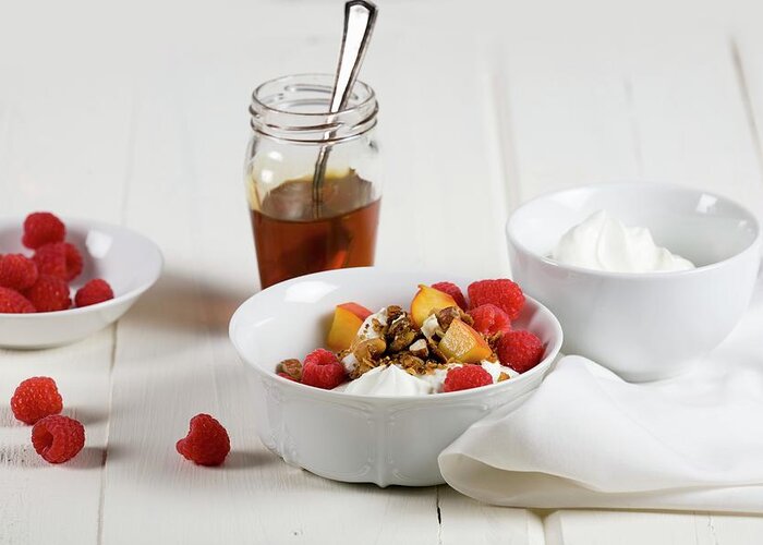 Ip_11324932 Greeting Card featuring the photograph Greek Yogurt With Fresh Fruit, Cereals And Honey by John Gagne