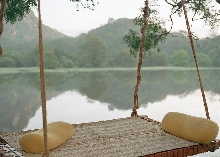 Tranquility Greeting Card featuring the photograph Hammock On Tree By Still Rural Lake by Laurie Castelli
