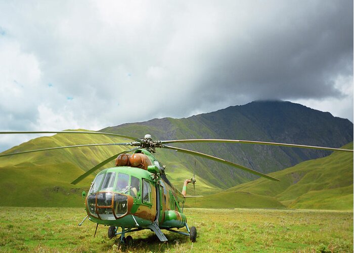Scenics Greeting Card featuring the photograph Helicopter In The Mountains Of Tusheti by Silvia Otte