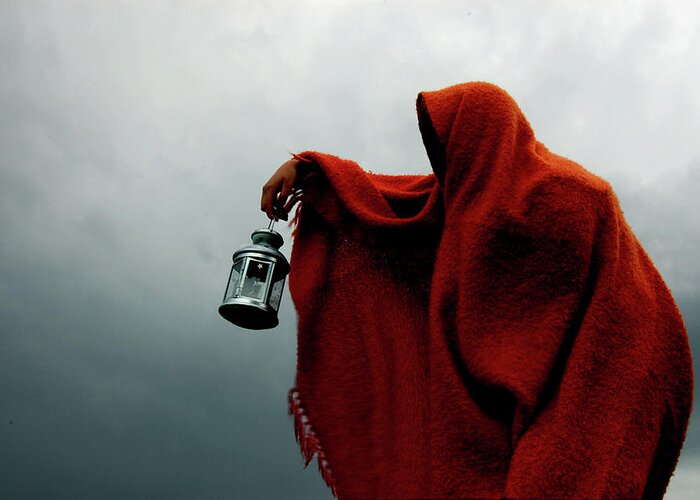 People Greeting Card featuring the photograph Hooded Crone Holds Lantern In Storm by Kewaters