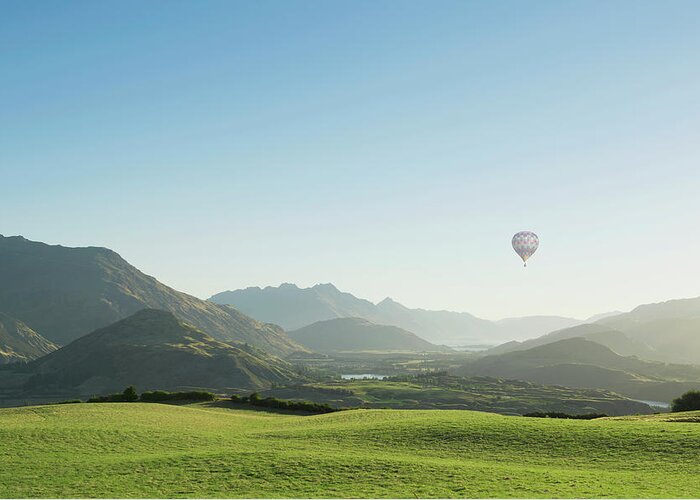 Tranquility Greeting Card featuring the photograph Hot Air Balloon Flying Above Rolling by Jacobs Stock Photography Ltd