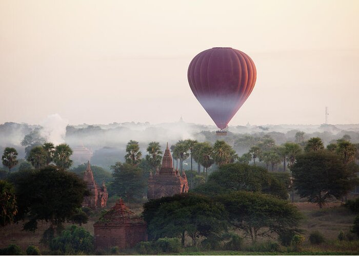 Pagoda Greeting Card featuring the photograph Hot-air Balloon Rising In Bagan by Wu Swee Ong
