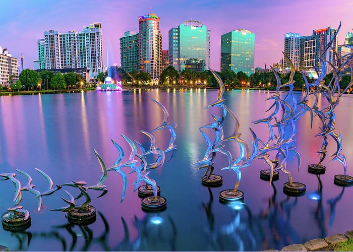 America Greeting Card featuring the photograph Lake Eola Take Flight and Orlando Skyline at Dusk by Gregory Ballos