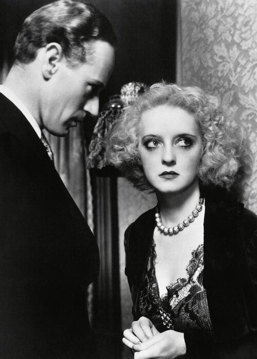Bette Davis Greeting Card featuring the photograph LESLIE HOWARD and BETTE DAVIS in OF HUMAN BONDAGE -1934-. by Album