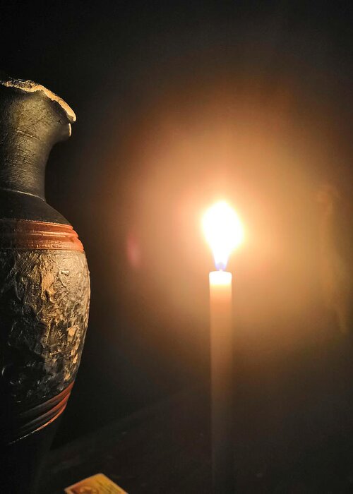 Candle Light Greeting Card featuring the photograph Light in the dark by Ian Batanda