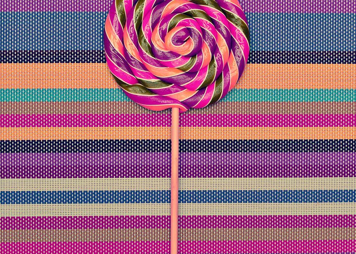 Lollipop On Bright Striped Background Greeting Card by Evgeniya  Porechenskaya