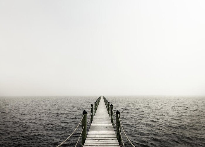 Water's Edge Greeting Card featuring the photograph Lonely Jetty by Lightkey