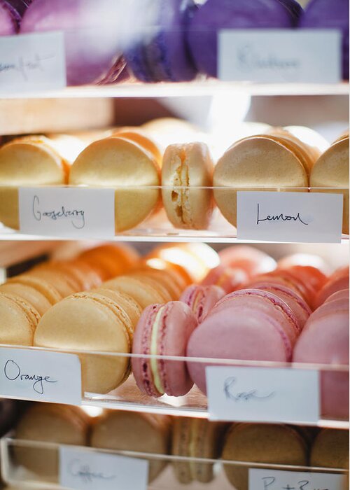 Unhealthy Eating Greeting Card featuring the photograph Macaroon Varieties In Bakery Display by Hybrid Images