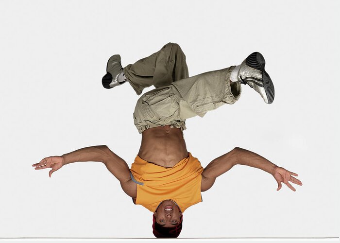 Human Arm Greeting Card featuring the photograph Male Breakdancer Balancing On Head by John Lamb