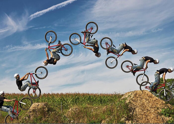 Young Men Greeting Card featuring the photograph Man Performing Stunt On Bmx Bike by Manuel Sulzer