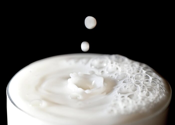 Milk Greeting Card featuring the photograph Milk Drops Falling In Glass Of Milk by Peter Chadwick Lrps
