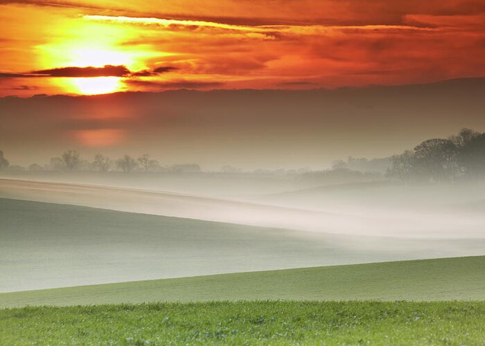 Tranquility Greeting Card featuring the photograph Mist Over Landscape Of Rolling Hills by Andy Freer