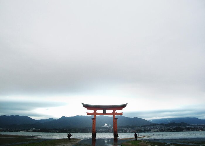 People Greeting Card featuring the photograph Miyajima Gate At Low Tide At Dusk by Michael Duva