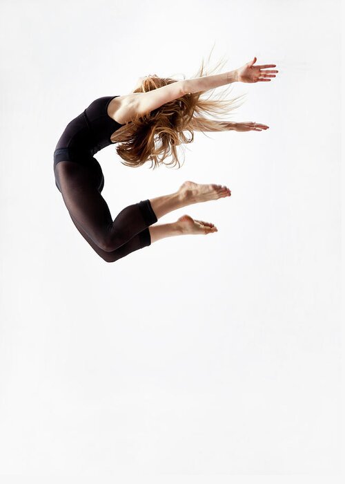 Human Arm Greeting Card featuring the photograph Modern Dancer Jumping In The Air by Jonya