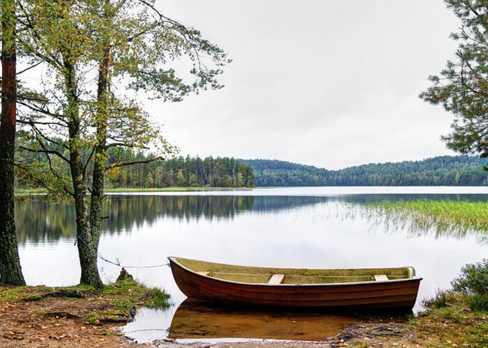 Tranquility Greeting Card featuring the photograph Nordic Skiff Eka Moored By A Quiet Lake by Johan Klovsjö