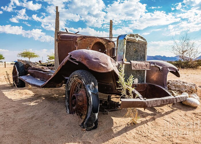 Car Greeting Card featuring the photograph Old and abandoned car #3 in Solitaire, Namibia by Lyl Dil Creations