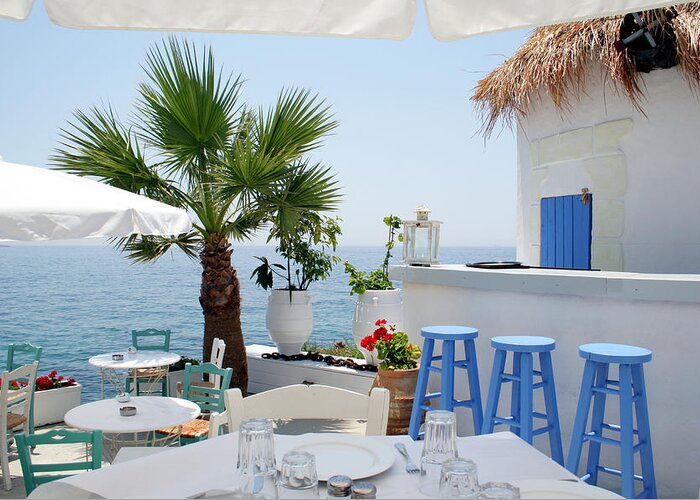 Greek Culture Greeting Card featuring the photograph Open Air Restaurant By The Sea In by Alanphillips