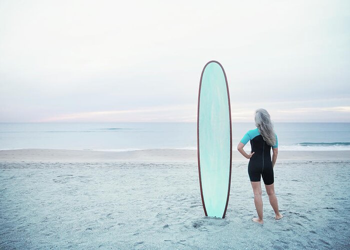 Female Greeting Card featuring the photograph Rear View Of Female Surfer Standing By Surfboard On Delray Beach by Cavan Images