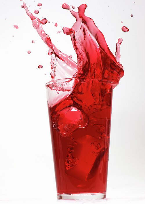 White Background Greeting Card featuring the photograph Red Juice Spilling From Glass by Alex Cao