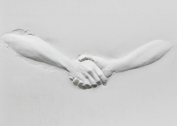 Human Arm Greeting Card featuring the photograph Relief Of Handshake by Henrik Sorensen