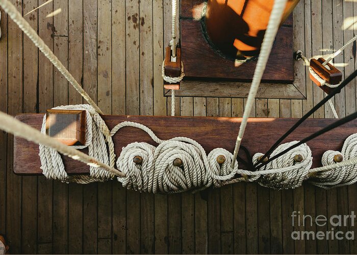 Abstract Greeting Card featuring the photograph Ropes to hold the sails of an old sailboat rolled. by Joaquin Corbalan