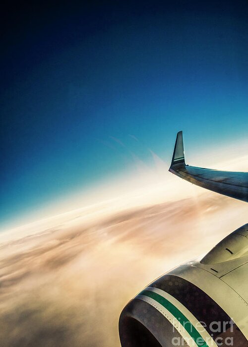 Amyn Nasser Greeting Card featuring the photograph Sleek Jet Blue Sky Aerial by Neptune - Amyn Nasser Photographer