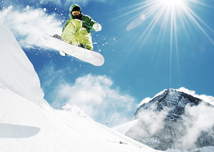 Sliding Greeting Card featuring the photograph Snowboarder At Jump Inhigh Mountains by Im photo