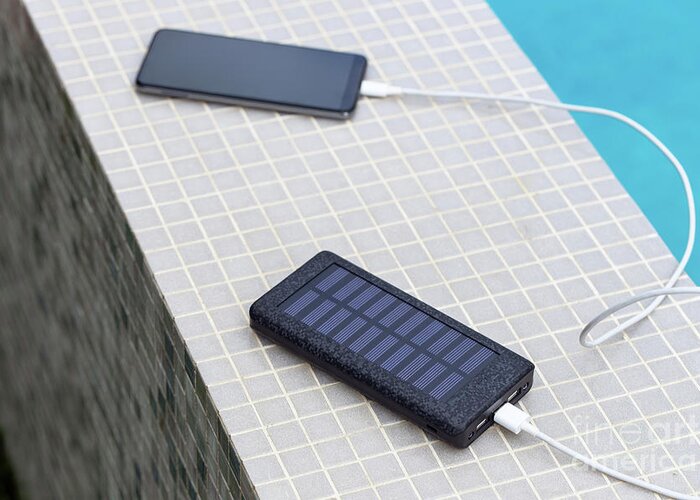 Smartphone Greeting Card featuring the photograph Solar Smartphone Charger by Sakkmesterke/science Photo Library