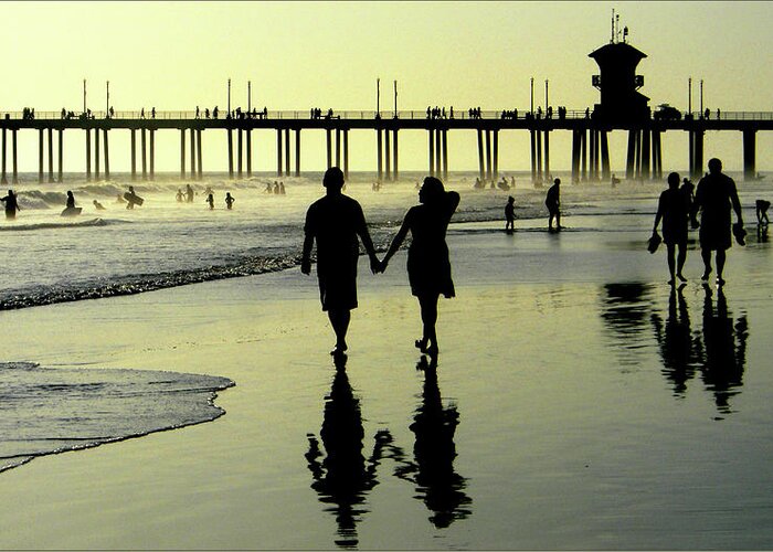 People Greeting Card featuring the photograph Sunset Walk On The Beach by Bnat