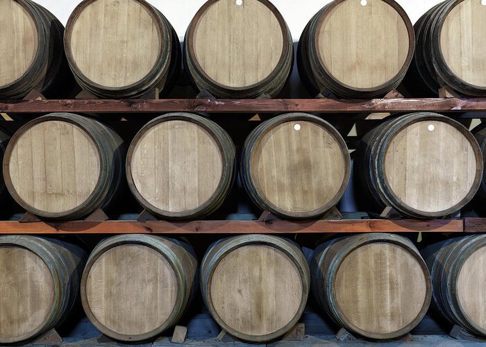 In A Row Greeting Card featuring the photograph Winery Oak, Barrels At A Bodega On by Goldhafen