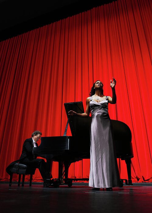 Expertise Greeting Card featuring the photograph Woman Singing On Stage Accompanied By by Thomas Barwick