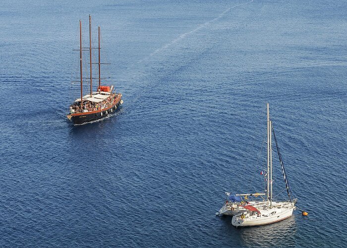 Sailing Greeting Card featuring the photograph Yachts sailing on a blue calm sea by Michalakis Ppalis