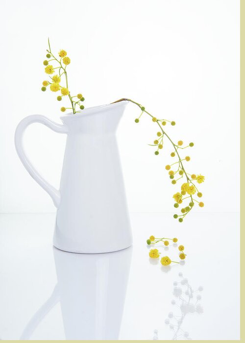 Decoration Greeting Card featuring the photograph Yellow beautiful flowers on a white vase. by Michalakis Ppalis
