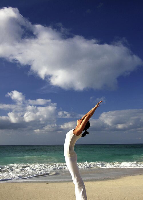 Human Arm Greeting Card featuring the photograph Young Woman Stretching On A Beach by Elke Selzle
