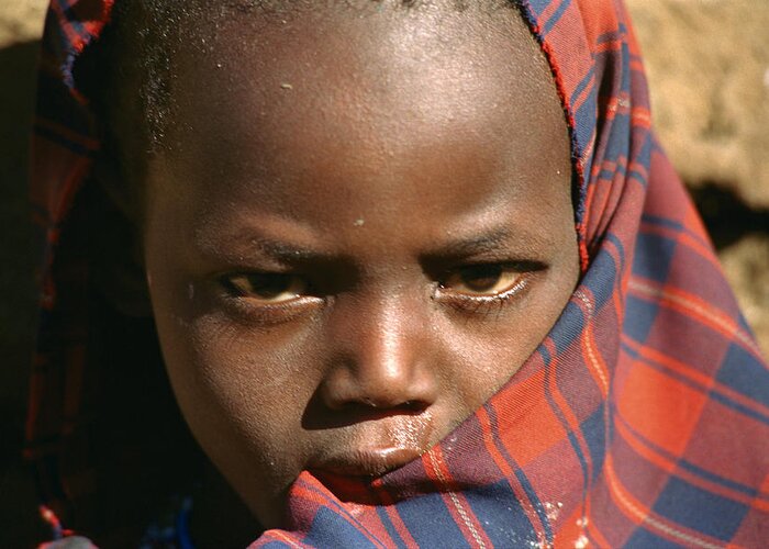 Africa Greeting Card featuring the photograph A Masai Child by Bonnie Colgan