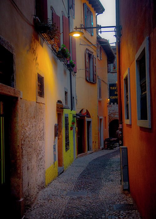Tourism Greeting Card featuring the photograph A Quiet Stroll in Malcesine by W Chris Fooshee