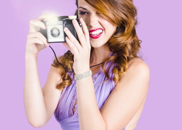 Camera Greeting Card featuring the photograph Amateur photographer practising with retro camera by Jorgo Photography