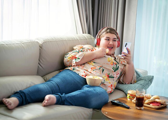 Asian fat enjoy eating a fat food Photograph by Anek Suwannaphoom