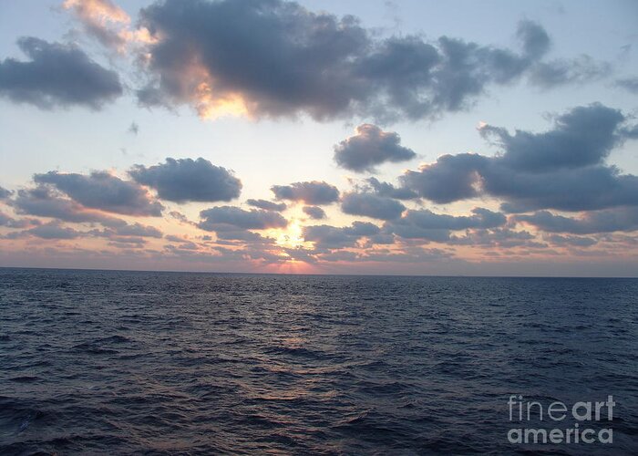 #gulfofmexico #underway #highseas #evening #dusk #sunset #clouds #cloudy #blueskies #sprucewoodstudios Greeting Card featuring the photograph Beacon of Warmth by Charles Vice