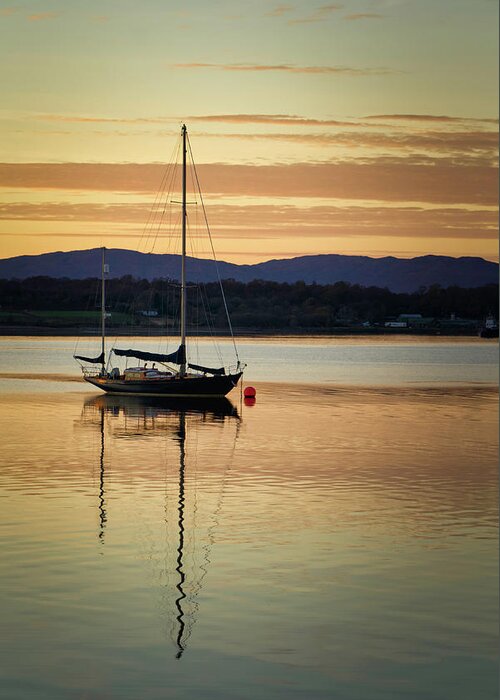 Blue Greeting Card featuring the photograph Boat On A Lake at Sunset by Rick Deacon