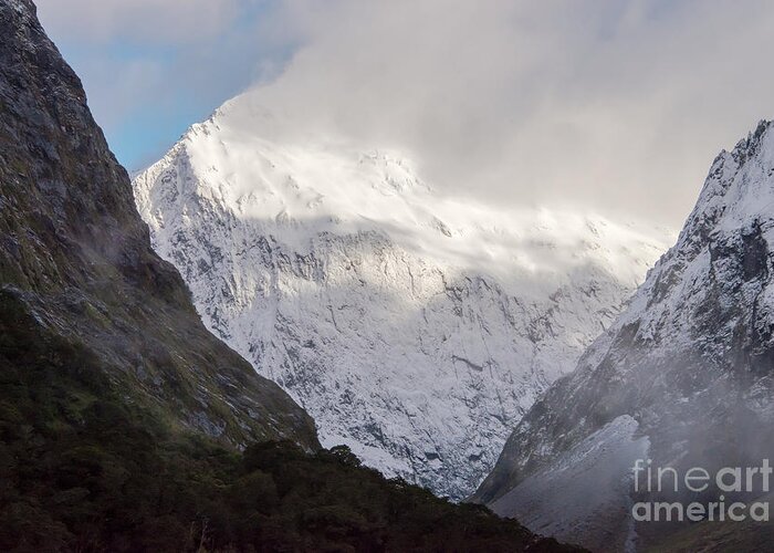 Milford Sound Greeting Card featuring the photograph Clouds and Snow around Milford Sound One by Bob Phillips