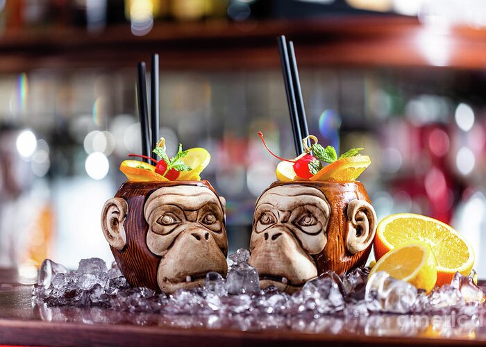 Cocktail Greeting Card featuring the photograph Coctail in monkey mugs on bar counter by Michal Bednarek