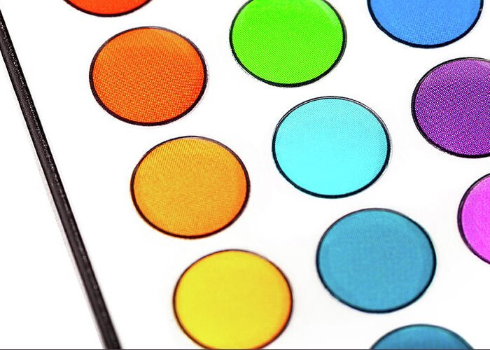 Colorful buttons on a led smart lighting remote control for controlling  light hue. Multi colored round buttons pattern closeup, macro shot. Simple  home rgb light automation control concept, background Greeting Card by