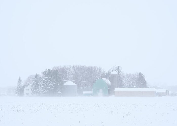 Pastel Greeting Card featuring the photograph Cool Pastels - pastel colored farm buildings in a Wisconsin snowstorm by Peter Herman