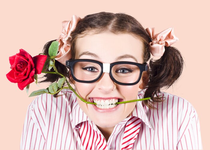 Funny Greeting Card featuring the photograph Cute Smiling Woman Wearing Nerd Glasses With Rose by Jorgo Photography
