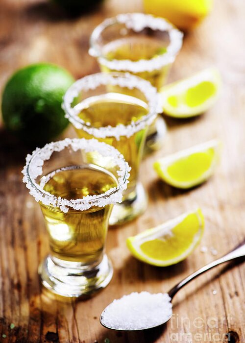 Tequila Greeting Card featuring the photograph Golden mexican tequila in shot glasses by Jelena Jovanovic